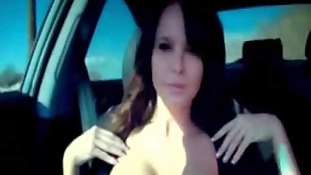 Beauty shows her big sexy tits in the car