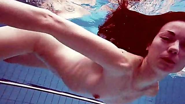 Underwater bikini striptease with a slender Euro beauty
